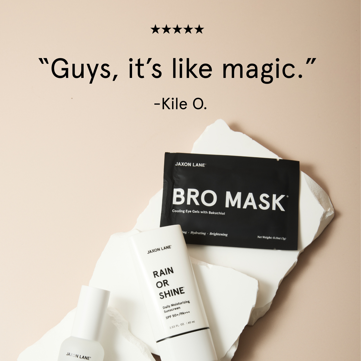 Jaxon Lane skincare products including 'Bro Mask' and 'Rain or Shine' on a beige background with a quote from Kile O.