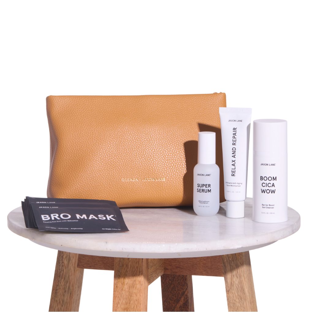 Skincare products and a brown clutch on a white surface oleada x jaxon lane