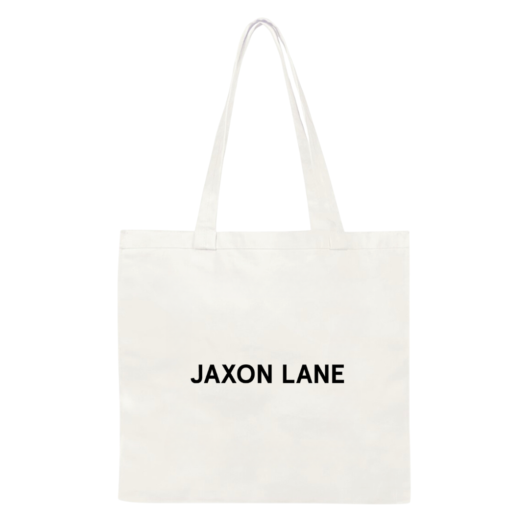 A white canvas tote bag with the Jaxon Lane brand name printed in black text on the side.