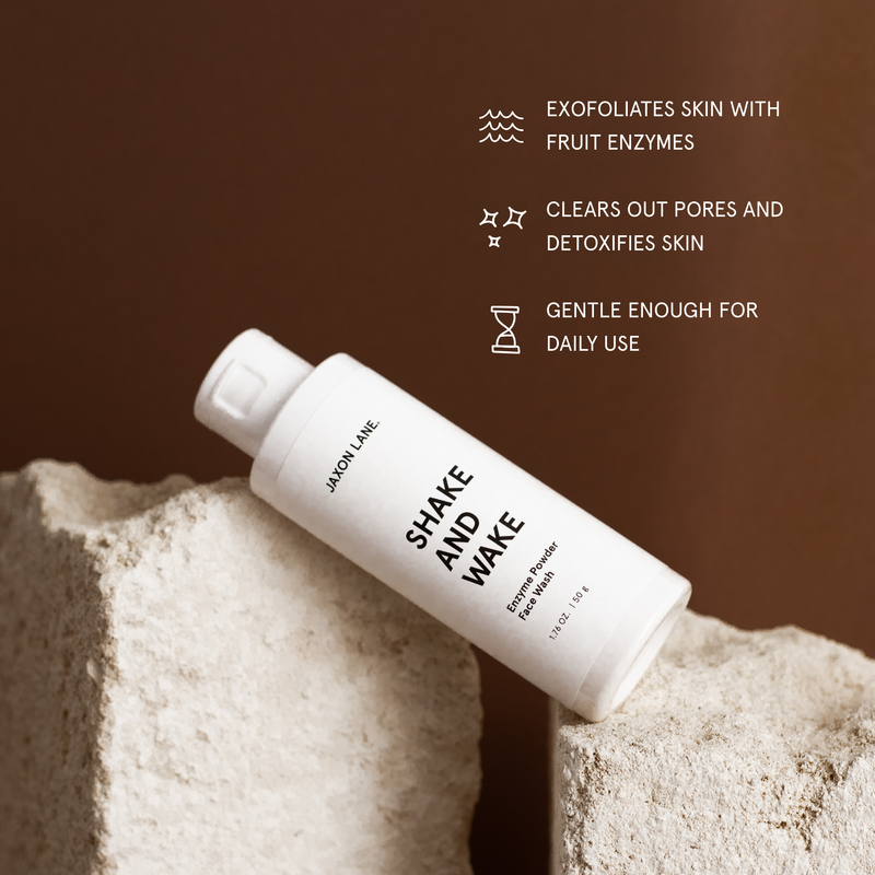 White bottle labeled 'Shake and Wake' on a textured surface with brown background